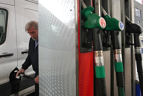 A man fills his car with diesel at a gas station in London, Monday, March 30, 2026. 