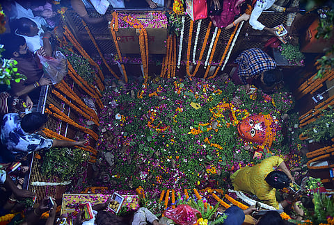 People offer prayers to Lord Hanuman on the occasion of the 'Hanuman Jayanti' festival, at 'Shri Bade Hanuman Ji Temple', in Prayagraj, Uttar Pradesh.