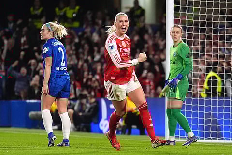 Arsenal's Stina Blackstenius celebrates scoring a goal before being ruled out via VAR for offside during the Women's Champions League quarterfinal second leg soccer match between Chelsea and Arsenal in London.