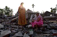 SURESH K PANDEY : Rasila and Rani from Andherjuli stand brfor eteir demolished house 