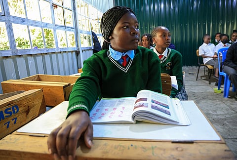 Everlyne Nasenya,16, left, and Valarie Wairimu, 19, both teen mothers are seen in a classroom at Greenland Girls School in Kajiado, Kenya.