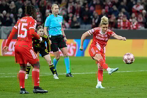 Bayern's Linda Dallmann scores her side's second goal during the Women's Champions League quarterfinal second leg soccer match between Bayern Munich and Manchester United in Munich, Germany.