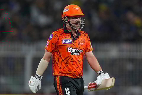 Sunrisers Hyderabad's Travis Head leaves the ground after losing his wicket during the Indian Premier League cricket match between Kolkata Knight Riders and Sunrisers Hyderabad in Kolkata, India.