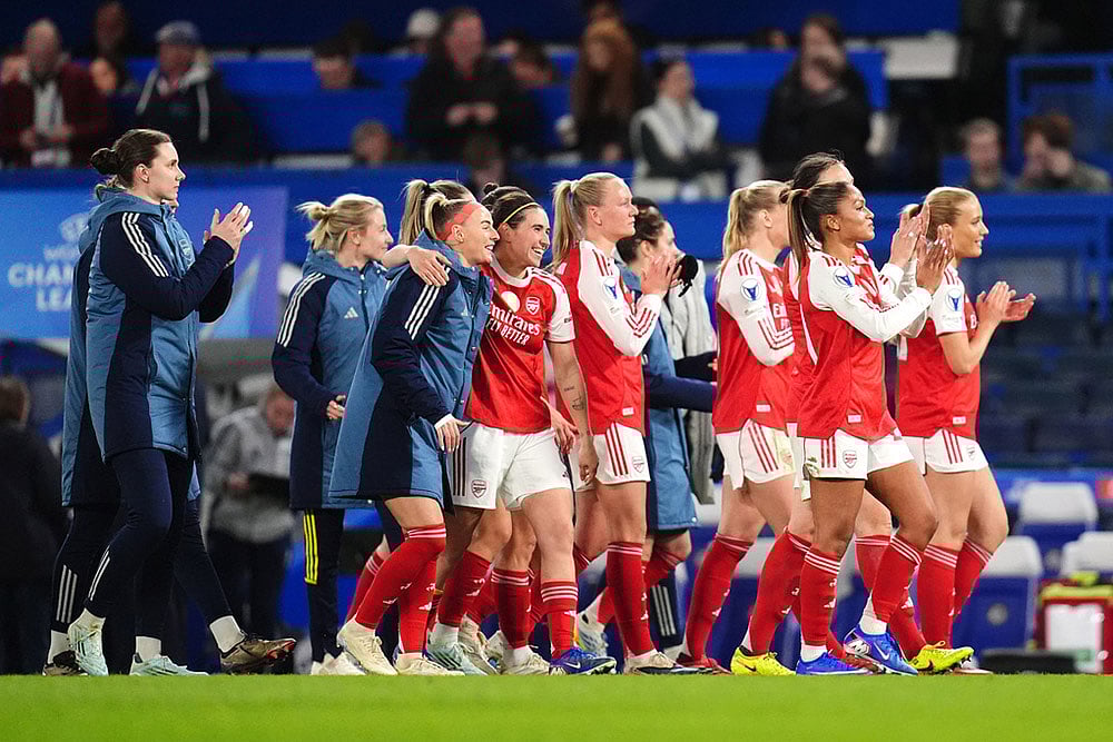 Arsenal players applaud fans after winning the Women's Champions League quarterfinal second leg soccer match against Chelsea in London. - | Photo: John Walton/PA via AP