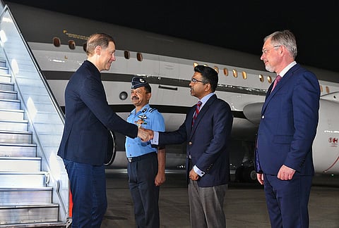 Russia's First Deputy Prime Minister Denis Manturov, left, being greeted upon his arrival, in New Delhi. 