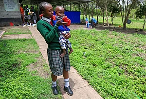 | Photo: AP/Andrew Kasuku : Valarie Wairimu, 19, interacts with her son, Kayden Darmain during breaktime at Greenland Girls School in Kiserian, Kajiado, Kenya.