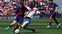 La Liga Matchday 30 Preview: Key Matchups, Players To Watch, Injury List – All You Need To Know | Photo: AP/Joan Monfort : Rayo's Pathe Ciss tackles Barcelona's Fermin Lopez during a La Liga soccer match between Barcelona and Rayo Vallecano in Barcelona, Spain, Sunday, March 22, 2026.