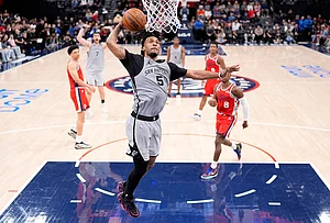 | Photo: AP/Mark J. Terrill : San Antonio Spurs guard Stephon Castle dunks during the second half of an NBA basketball game against the Los Angeles Clippers, Thursday, April 2, 2026, in Inglewood, California.