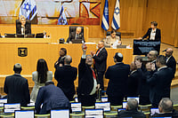 AP Photo/Itay Cohen : Israel's Minister of National Security, Itamar Ben-Gvir, center, and lawmakers celebrate after Israel's parliament passed a law approving the death penalty for Palestinians convicted of murdering Israelis, at the Knesset in Jerusalem Monday, March 30, 2026.