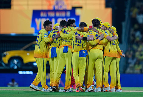 Chennai Super Kings players huddle together after losing a the Decision Review System (DRS) for the wicket of Punjab Kings' wicketkeeper Prabhsimran Singh during the Indian Premier League cricket match between Chennai Super Kings and Punjab Kings in Chennai.