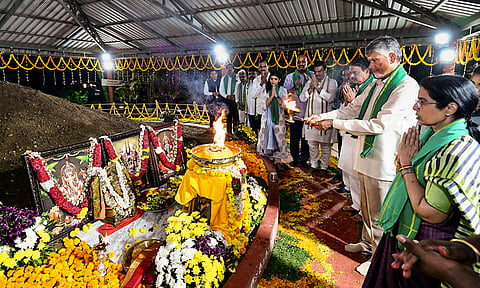 Andhra Pradesh CM N. Chandrababu Naidu with his wife Nara Bhuvaneshwari offers prayers at Undavalli after the Parliament passed a bill seeking to recognise Amaravati as the sole and new capital of the state. 