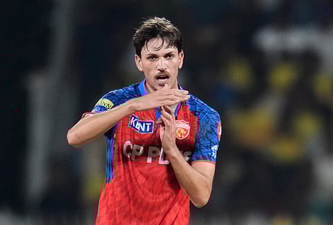 Punjab Kings' Marcus Stoinis asks the Decision Review System (DRS) for the wicket Chennai Super Kings' Kartik Sharma of during the Indian Premier League cricket match between Chennai Super Kings and Punjab Kings in Chennai.