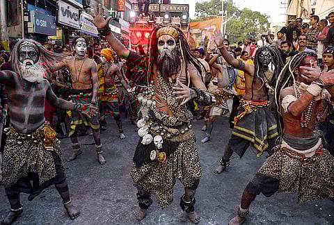 Tribal artists perform during a religious procession on the ‘Hanuman Jayanti’ festival, in Dehradun.