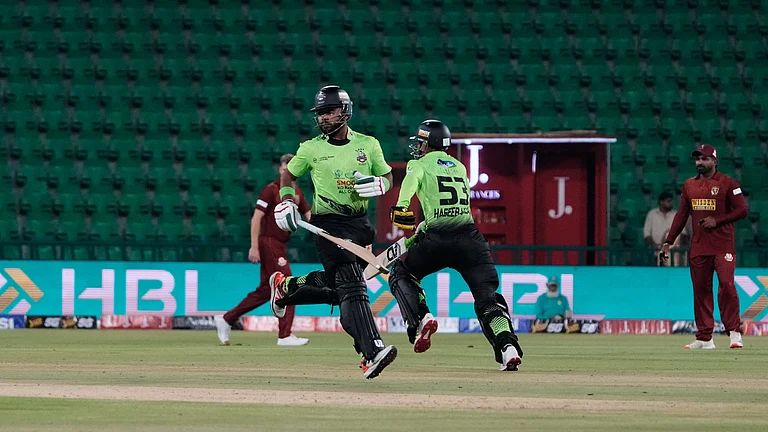 Lahore Qalandars' Fakhar Zaman, second left, and Haseeb Ullah, second right, run between the wickets during the opening cricket match of the Pakistan Super League between Lahore Qalandars and Hyderabad Kingsmen, which taking place without spectators, in Lahore, Pakistan, Thursday, March 26, 2026. - | Photo: AP/K.M. Chaudary