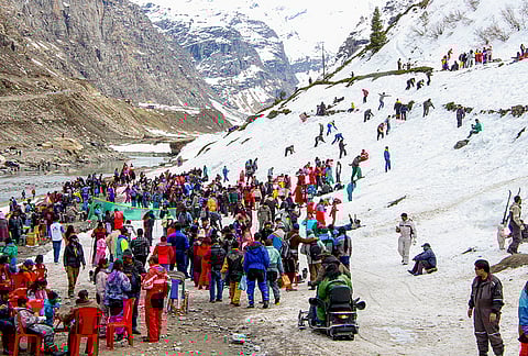 Tourists gather at the snow-covered area near the Atal Tunnel North Portal, in Lahaul and Spiti district.