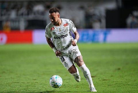Santos' Neymar carries the ball during a Brazilian soccer league match against Remo in Santos, Brazil.