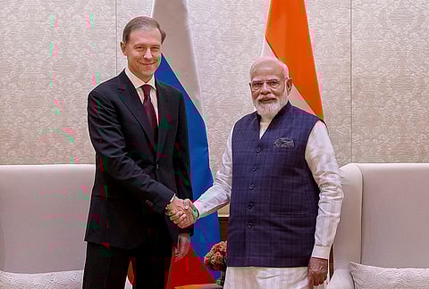 Prime Minister Narendra Modi with Russia First Deputy Chairman Denis Manturov during a meeting, in New Delhi. 
