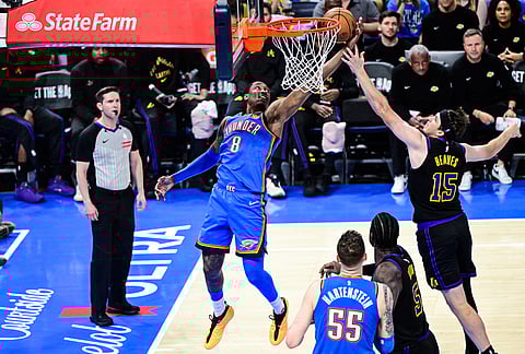 Oklahoma City Thunder guard/forward Jalen Williams (8) shoots against Los Angeles Lakers guard Austin Reaves (15) during the second half of an NBA basketball game in Oklahoma City.