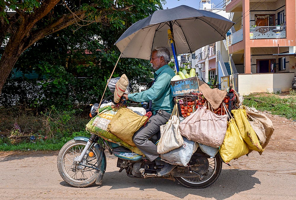 Vendor carries vegetables