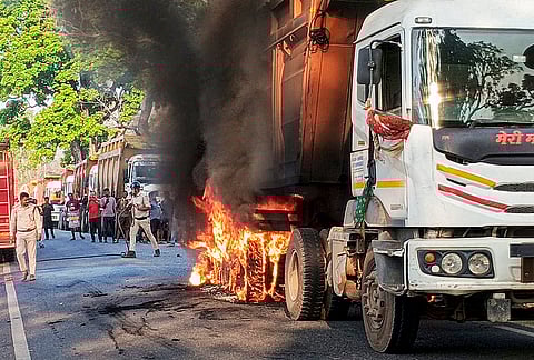 Smoke billows during a fire in a truck, at Silli police station area, in Ranchi district, Jharkhand.