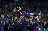 | Photo: AP/Joan Monfort : Barcelona's Alexia Putellas is lifted in the air by her teammates to celebrate her 500th match with Barcelona at the end of a Champions League quarterfinal soccer match between Barcelona and Real Madrid, in Barcelona, Spain.