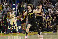 | Photo: AP/Jeff Chiu : Golden State Warriors guard Brandin Podziemski (2) celebrates after teammate forward Gui Santos scored against the Cleveland Cavaliers during the second half of an NBA basketball game in San Francisco.