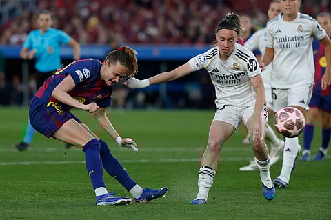 Barcelona's Graham Hansen scores her side's fifth goal during a Champions League quarterfinal soccer match between Barcelona and Real Madrid, in Barcelona, Spain.