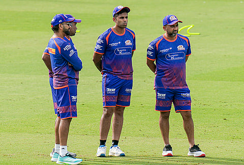 From left, Mumbai Indians' Rohit Sharma, head coach Mahela Jayawardene, Suryakumar Yadav and chief officer of performance data and innovation Dhananjai CKM during a practice session ahead of an Indian Premier League (IPL) 2026 T20 cricket match between Delhi Capitals and Mumbai Indians, in New Delhi.