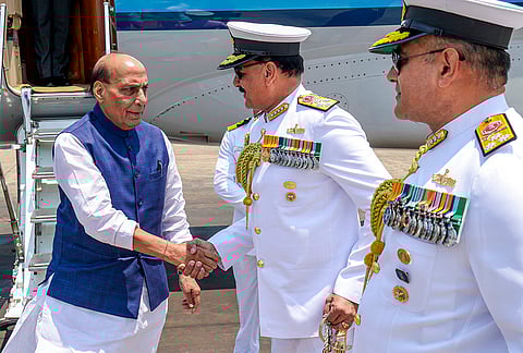 Defence Minister Rajnath Singh with Chief of Naval Staff Admiral Dinesh Kumar Tripathi on his arrival in Visakhapatnam. 