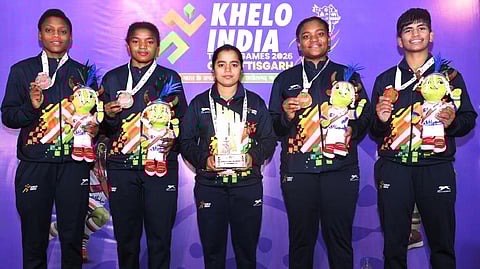 Members of the Karnataka wrestling contingent posing with their medals at Khelo India Tribal Games 2026.
