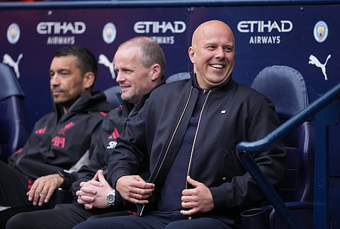 Liverpool's manager Arne Slot smiles during the FA Cup quarter-final soccer match between Manchester City and Liverpool in Manchester, England.