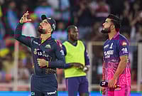 | Photo: PTI/Kamal Kishore : Gujarat Titans' captain Rashid Khan, left, flips the coin as Rajasthan Royals' captain Riyan Parag takes the call during the toss before an Indian Premier League (IPL) 2026 T20 cricket match between Gujarat Titans and Rajasthan Royals, in Ahmedabad, Gujarat.