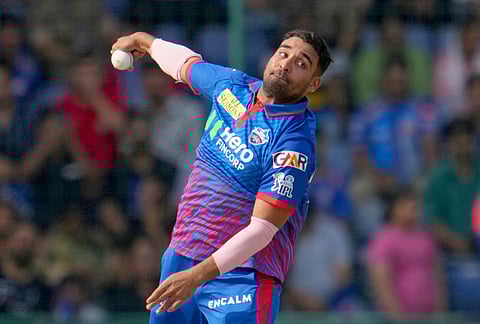 Delhi Capitals' Vipraj Nigam bowls a delivery during the Indian Premier League cricket match between Delhi Capitals and Mumbai Indians in New Delhi.
