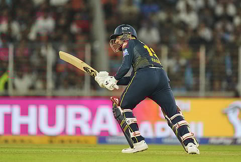 Gujarat Titans' Rashid Khan plays a shot during the Indian Premier League cricket match between Gujarat Titans and Rajasthan Royals in Ahmedabad.