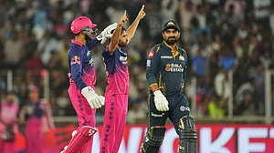 AP Photo : Rajasthan Royals players celebrating a wicket with Ravi Bishnoi against Gujarat Titans in IPL 2026 at Narendra Modi Stadium in Ahmedabad.