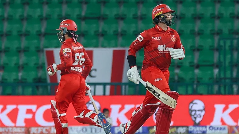 Sameer Minhas and Devon Conway in action for Rawalpindiz during PSL 2026 clash against Islamabad United at Gaddafi Stadium in Lahore. - null
