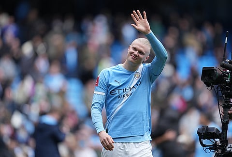 Manchester City's Erling Haaland reacts after the FA Cup quarter-final soccer match between Manchester City and Liverpool in Manchester, England.