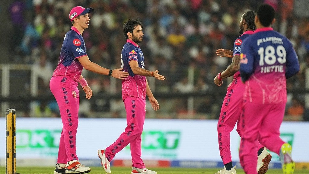 Rajasthan Royals cricketers celebrate a wicket with Ravi Bishnoi during IPL 2026 clash against Gujarat Titans.  - AP Photo
