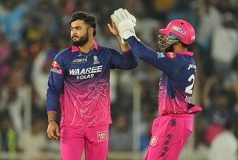 Rajasthan Royals' captain Riyan Parag, left, and Dhruv Jurel celebrates the wicket of Gujarat Titans' Kumar Kushagra during the Indian Premier League cricket match between Gujarat Titans and Rajasthan Royals in Ahmedabad.
