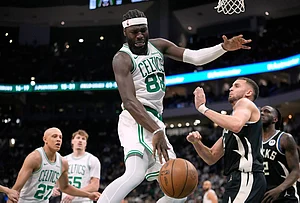 | Photo: AP/Aaron Gash : Boston Celtics' Neemias Queta (88) loses control of the ball against Milwaukee Bucks' Pete Nance during the second half of an NBA basketball game in Milwaukee.