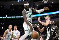 Milwaukee Bucks Vs Boston Celtics, NBA 2026: Celtics Steamroll Bucks 133-101; Brown And Tatum Shine | Photo: AP/Aaron Gash : Boston Celtics' Neemias Queta (88) loses control of the ball against Milwaukee Bucks' Pete Nance during the second half of an NBA basketball game in Milwaukee.