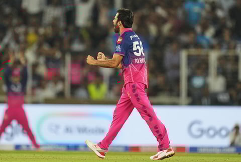 Rajasthan Royals' Ravi Bishnoi celebrates the wicket of Gujarat Titans' Rahul Tewatia during the Indian Premier League cricket match between Gujarat Titans and Rajasthan Royals in Ahmedabad.