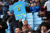 | Photo: AP/Jon Super : Mancheter City fans wait for start of the FA Cup quarter-final soccer match between Manchester City and Liverpool in Manchester, England.