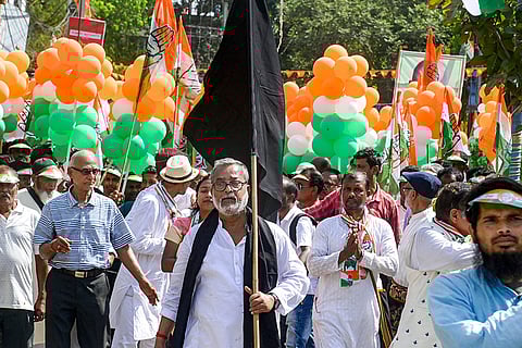Congress activists during a protest march against the alleged removal of voters' names from electoral rolls during the Special Intensive Revision (SIR) process, in Balurghat, Dakshin Dinajpur district, West Bengal.