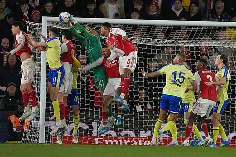 Southampton's goalkeeper Daniel Peretz, fifth from left, saves the ball during the English FA Cup quaterfinal soccer match between Southampton and Arsenal in Southampton, England.