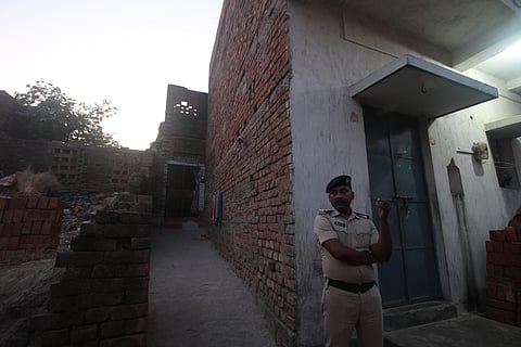 Police personnel deployed to guard the victim’s residence.