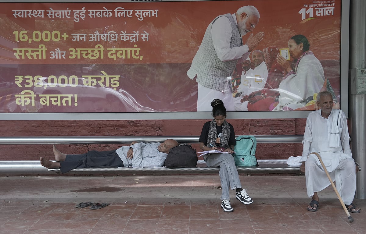 A Poster displaying Indian Prime Minister Narendra Modi at Bus Stand in New Delhi. - by Tribhuvan Tiwari