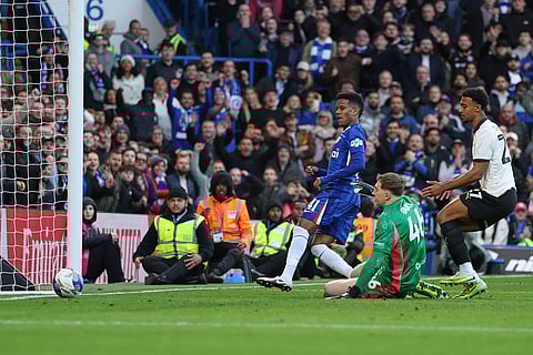 Chelsea's Estevao, left, scores past Port Vale's Joe Gauci his side's sixth goal during the English FA Cup quarterfinal soccer match between Chelsea and Port Vale in London, England.