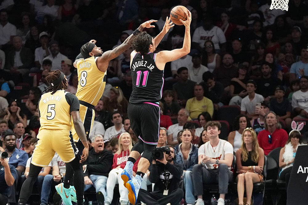 Miami Heat forward Jaime Jaquez Jr. (11) aims to score as Washington Wizards guard Jaden Hardy (8) defends during the first half of an NBA basketball game in Miami. - | Photo: AP/Marta Lavandier