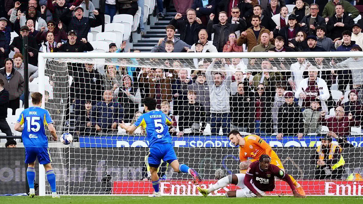 West Ham United's Axel Disasi, center right, scores their side's second goal during their English FA Cup, quarter-final soccer match against Leeds United in London, Sunday, April 5, 2026. - (John Walton/PA via AP)
